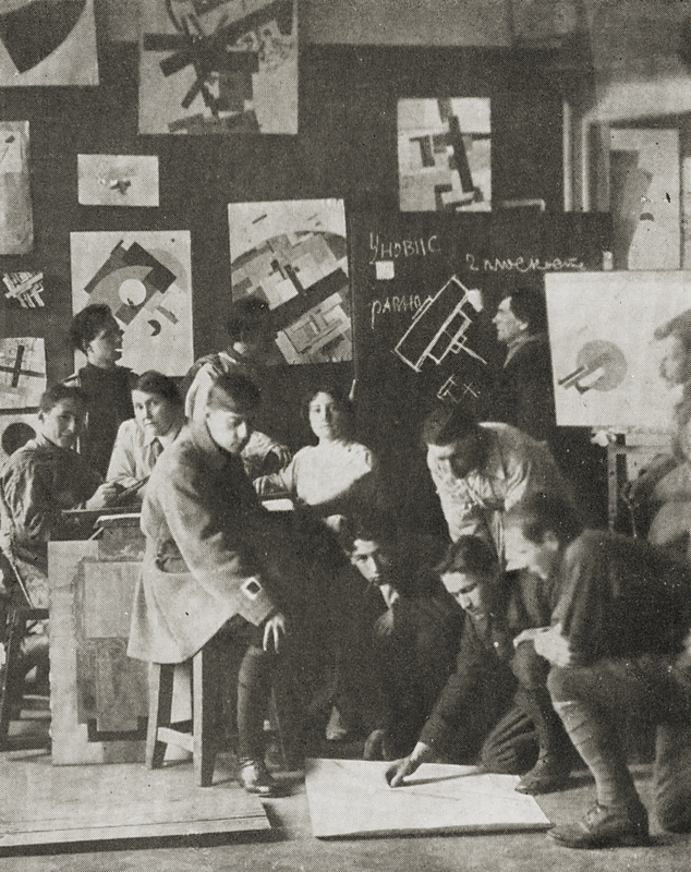 Classes at the Unovis workshop. September 1920. Kazimir Malevich is on the background, at the board. Classes at the Unovis workshop. September 1920. Kazimir Malevich is on the background, at the board.