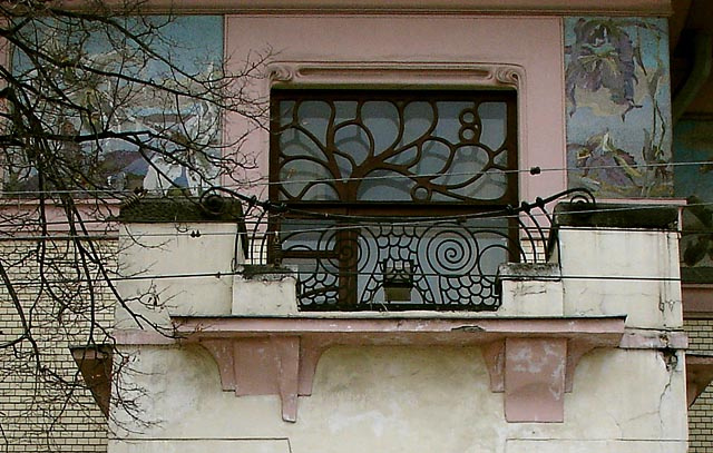 Balcony with spiral owl eyes against the frieze with orchids. Ryabushinsky mansion.