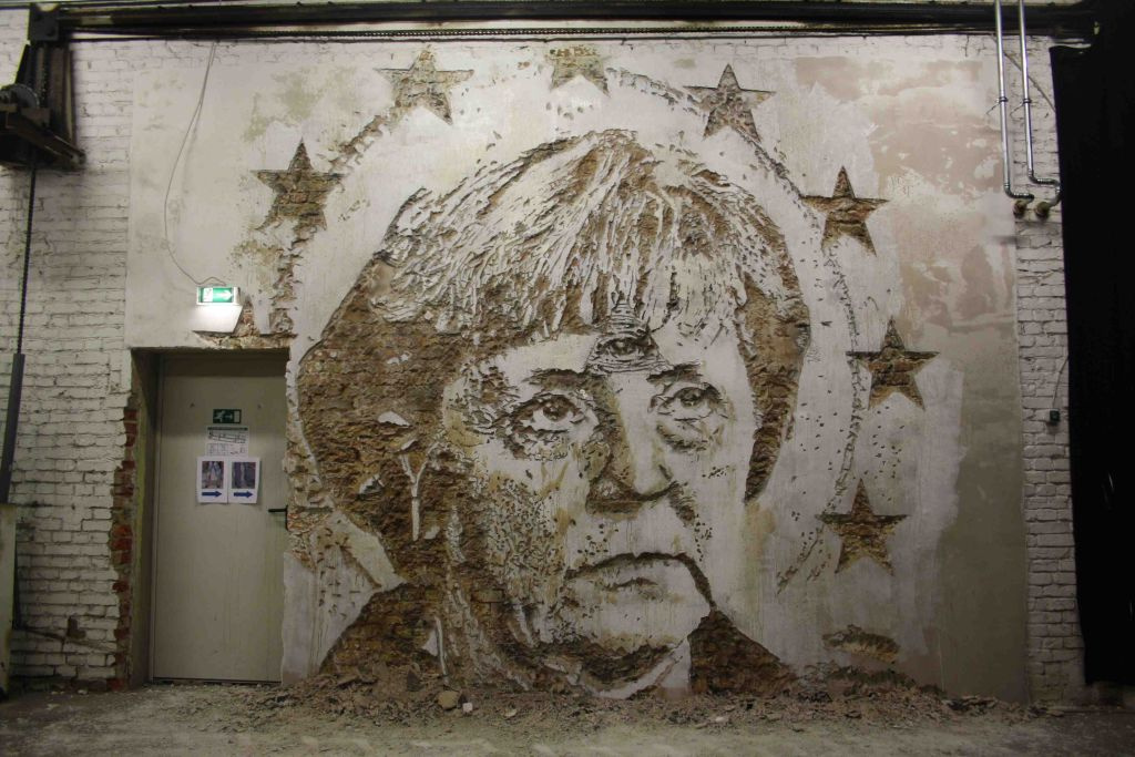 The artwork by the artist Vhils is made using the scratching technique.