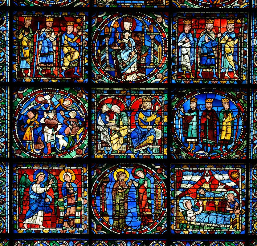 Stained glass window with the Nativity and Christ’ Childhood scenes at Chartres Cathedral. Photo Sou
