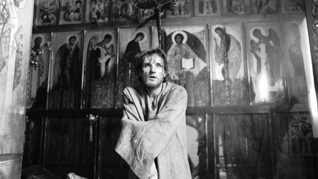 Andrei Rublev (actor Anatoly Solonitsyn) on the background of the iconostasis in the Dormition Cathe Andrei Rublev (actor Anatoly Solonitsyn) on the background of the iconostasis in the Dormition Cathe