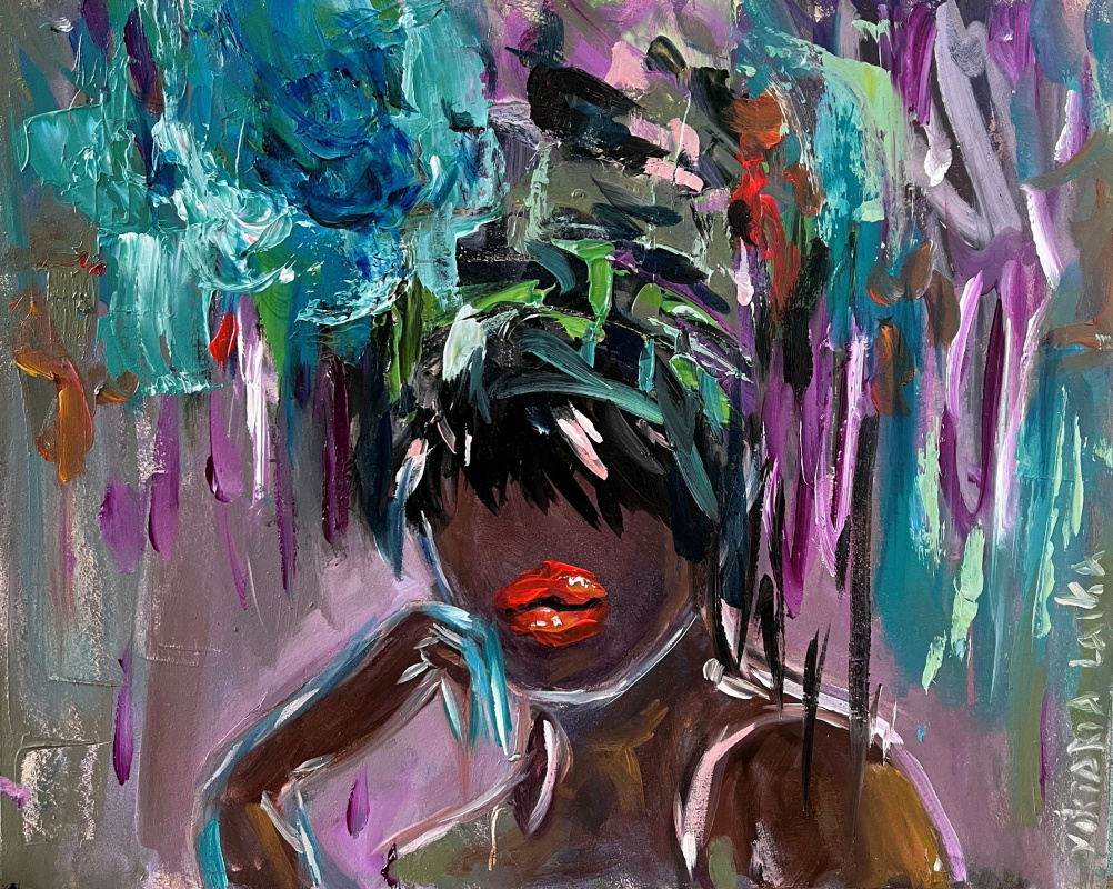 African woman with a blue flower on her head