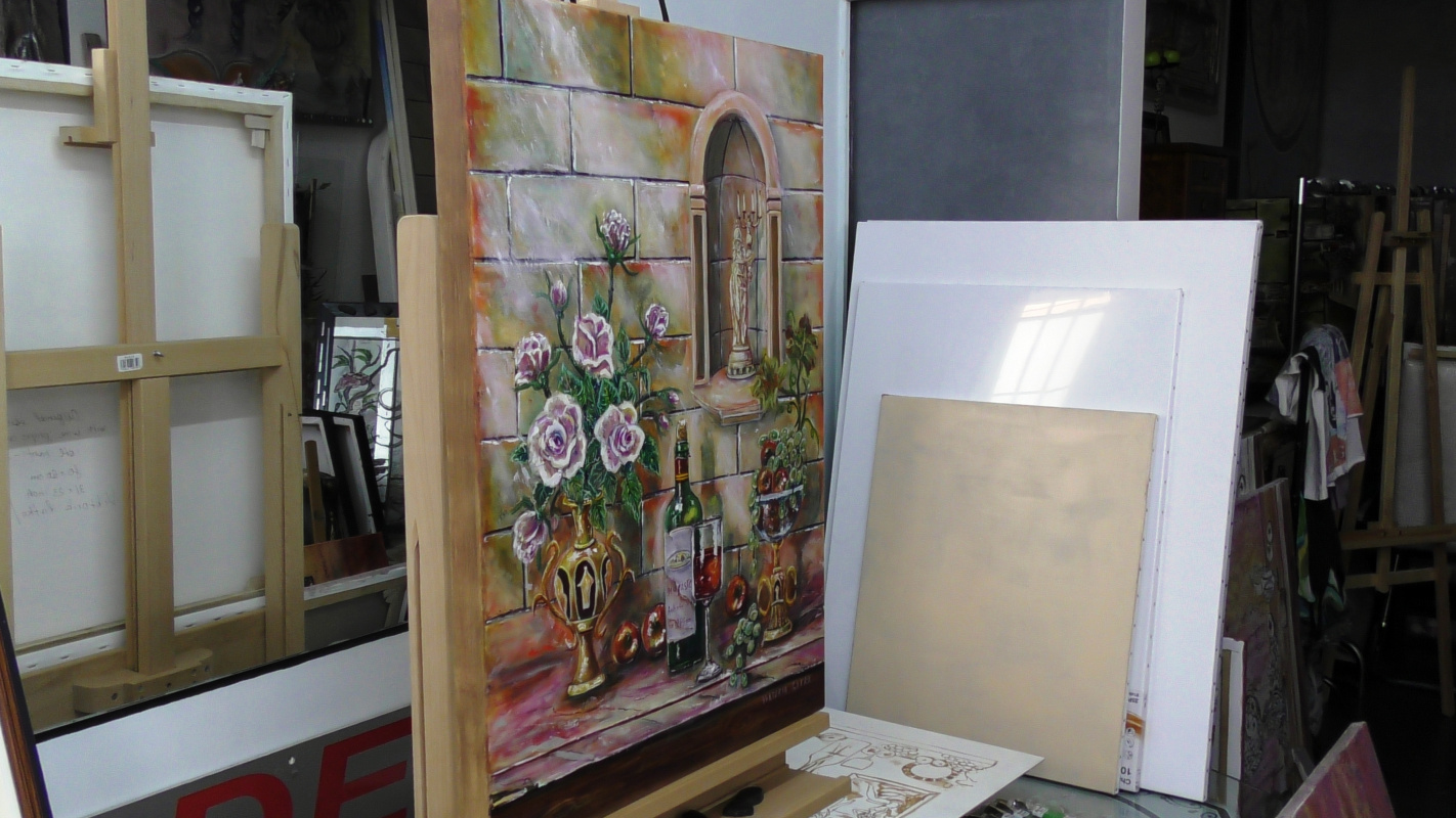 Still life with wine, roses and antique gold objects